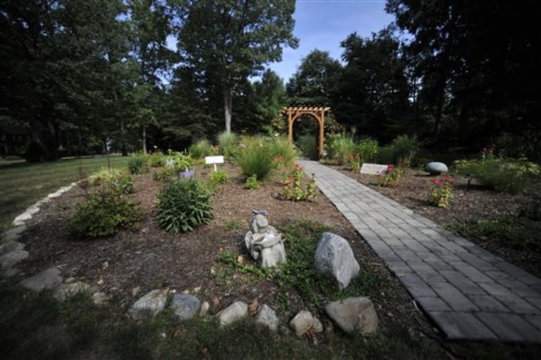 A remembrance garden is in place where the house of the Petit family once stood in Cheshire, Conn. In July 2007, intruders broke into the Petit family home and held the family hostage for several hours before setting the house on fire. Dr. William Petit Jr., was severely beaten, and his wife and two daughters were killed. 